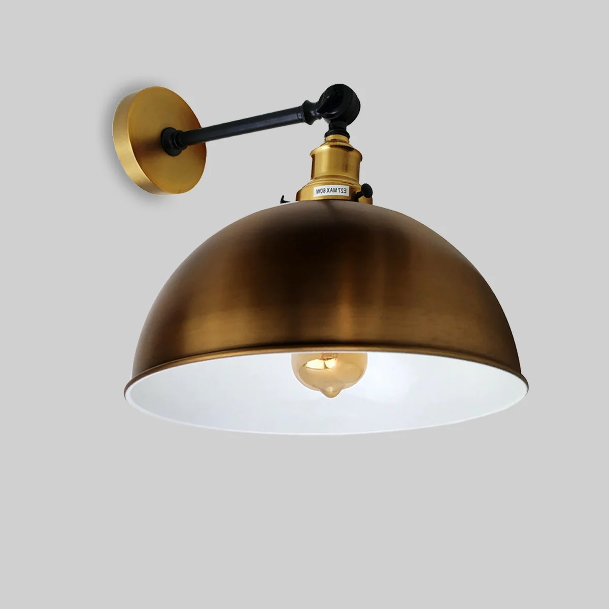 Vintage style yellow brass wall light with adjustable arm and dome-shaped shade, E27 bulb included, mounted on white wall