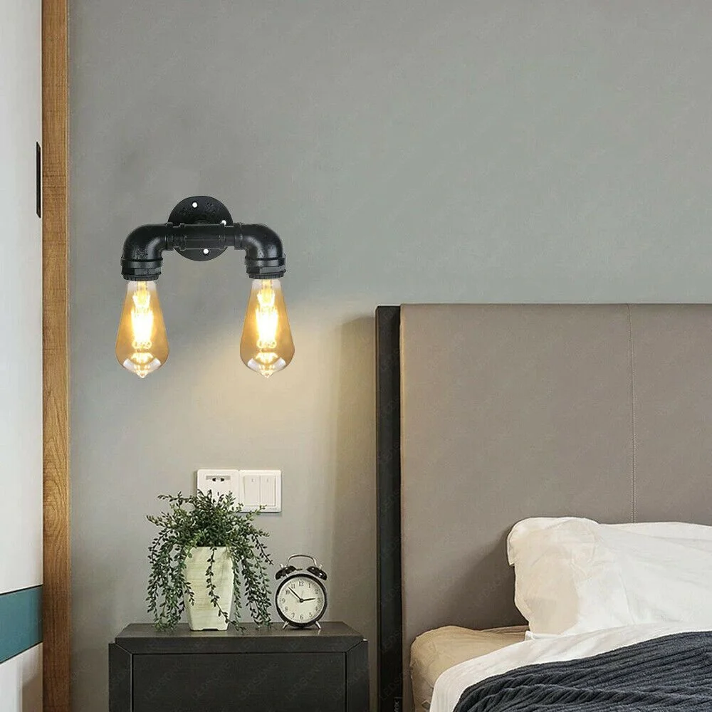 Twin black metal retro water pipe light mount with two water‑pipe shaped heads on wall