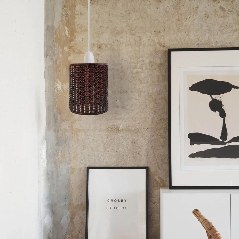 Rustic red industrial metal ceiling lampshade with open drum wire cage design, shown from angled side view