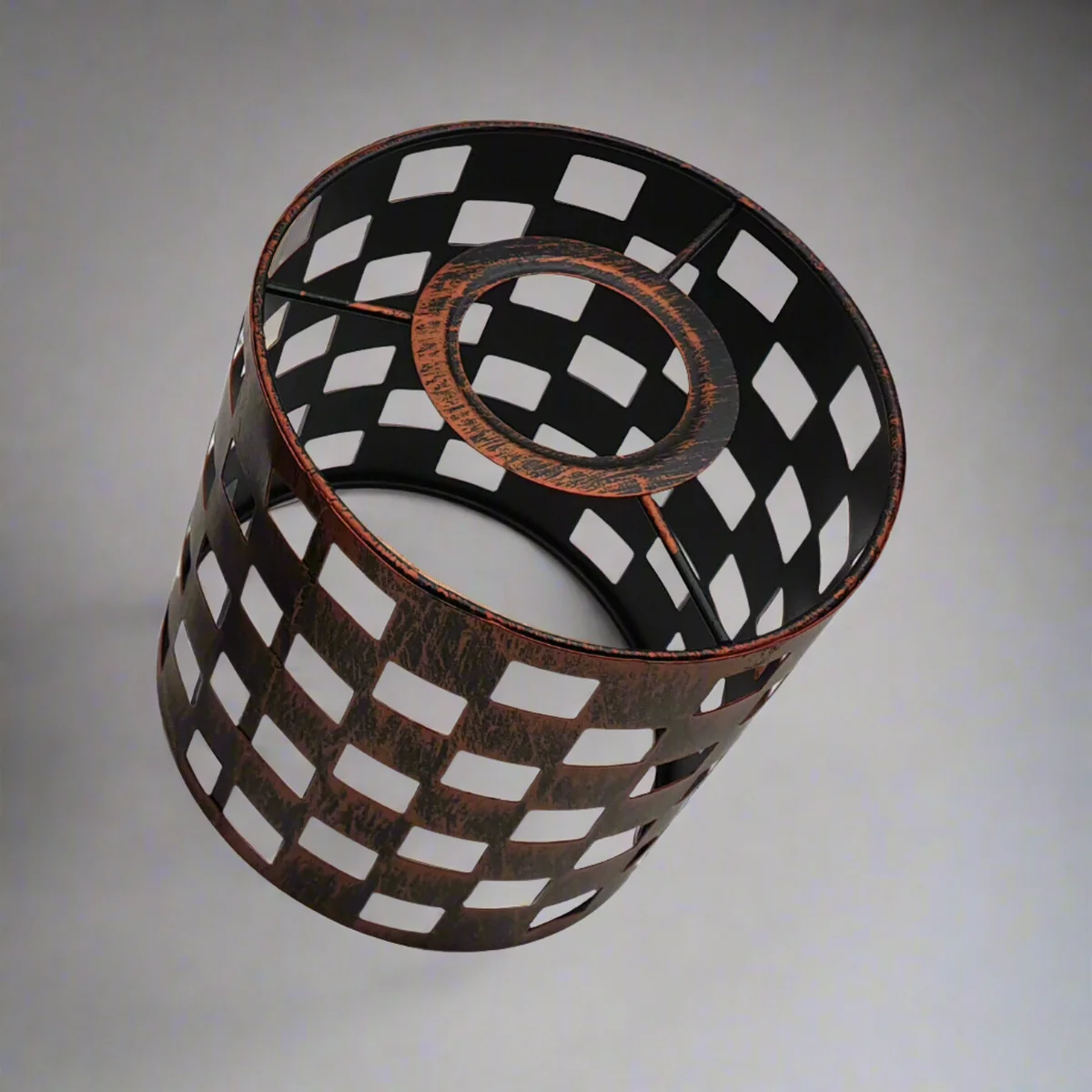 Black metal wire drum cage lampshade shown installed on easy fit ceiling light with visible bulb inside
