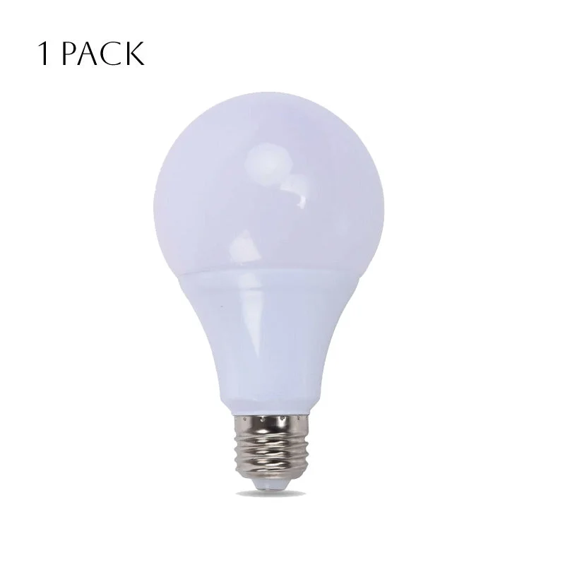 Five LED E27 bulbs with A60 shape and cool daylight white light arranged on a white surface