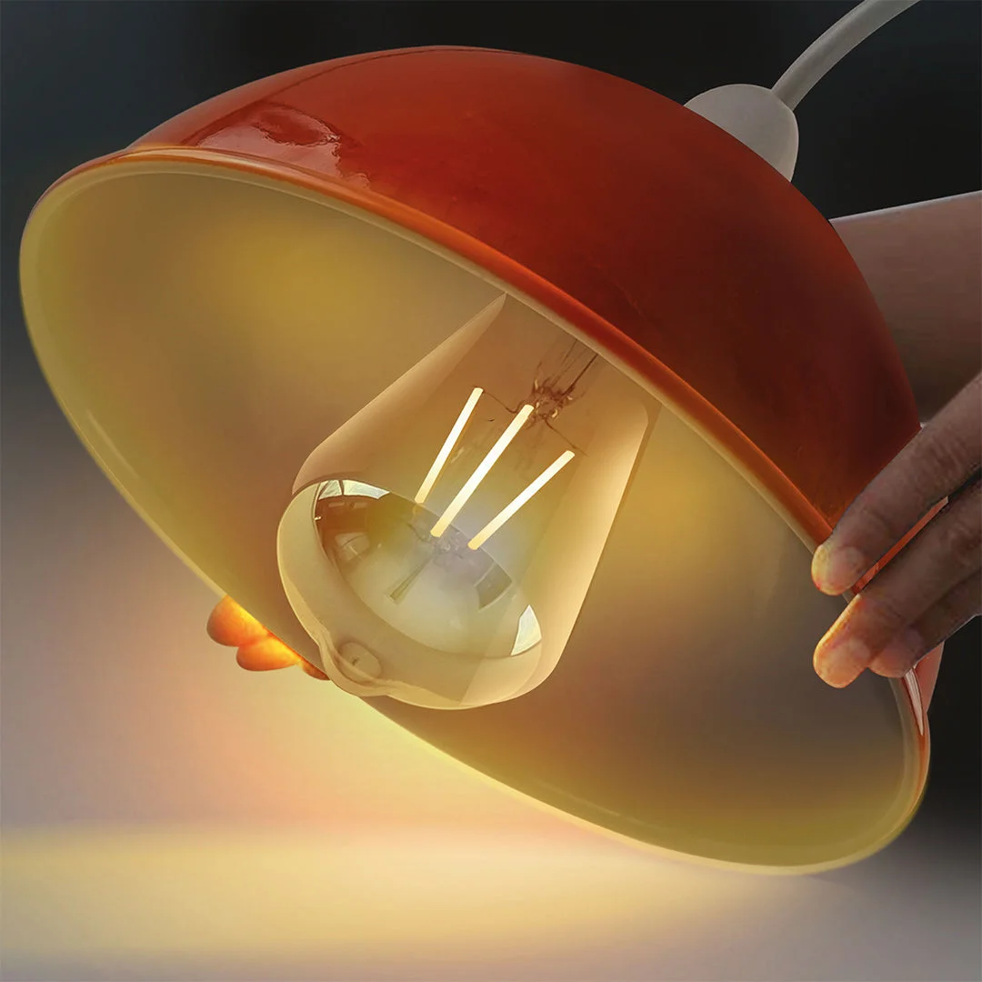 Orange iron light shade with dome shape and brushed nickel finish, angled for sloped ceiling installation, 30cm diameter
