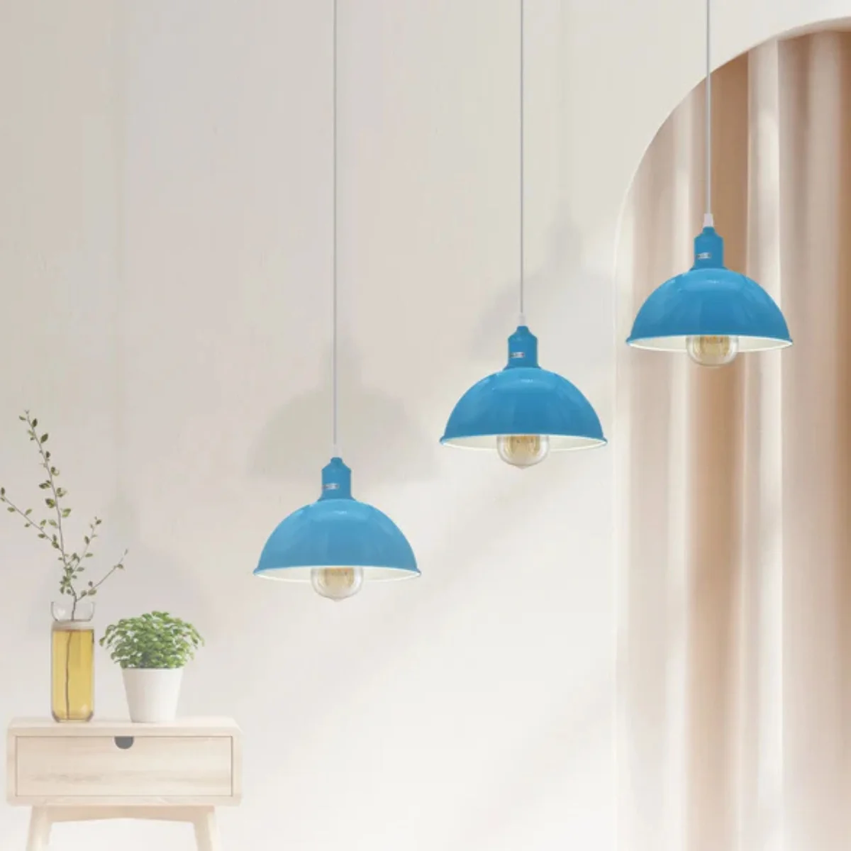 Blue industrial vintage 3 light ceiling fitting with adjustable cables and metal shades hanging indoors