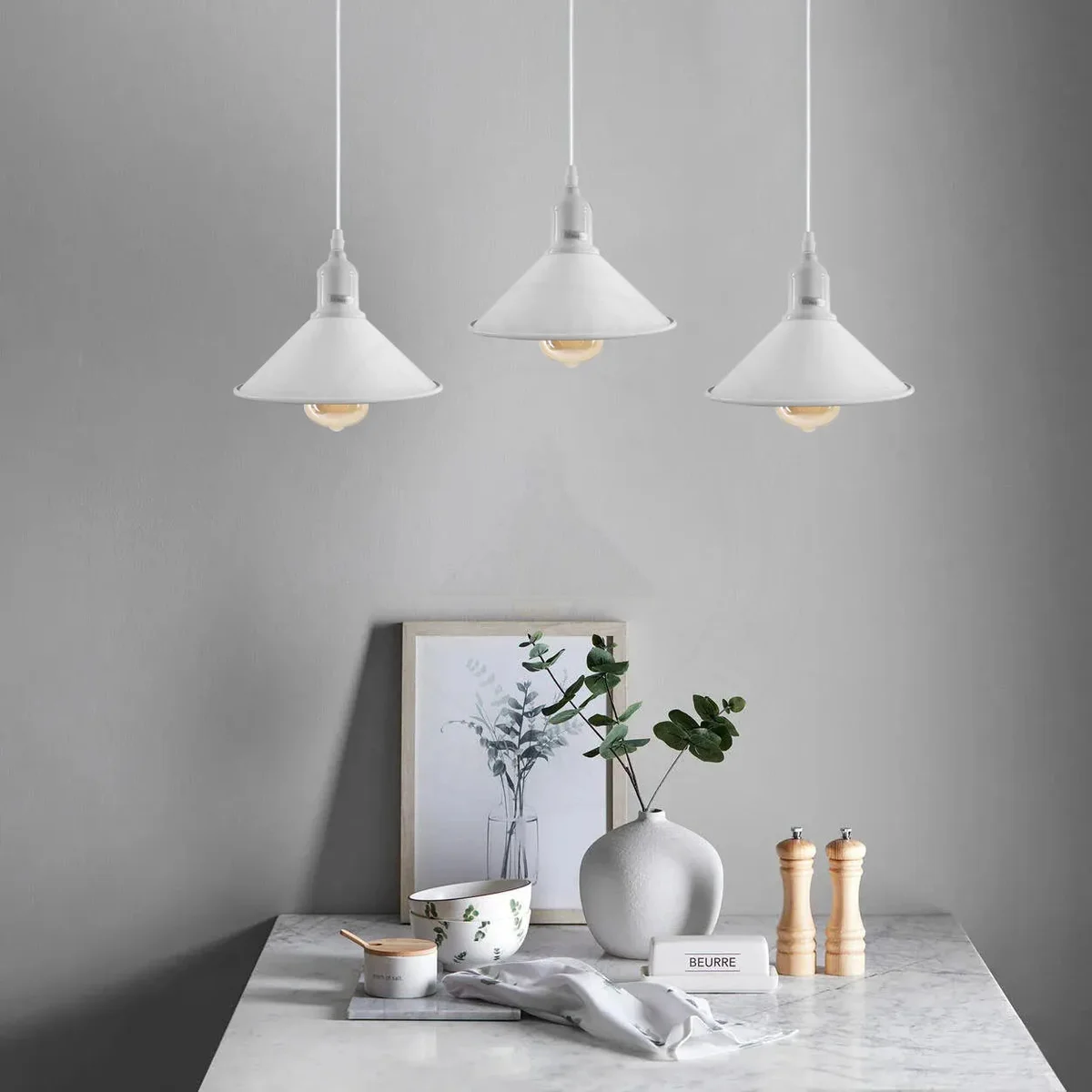 Three vintage pendant ceiling light fittings with metal shades and adjustable cords hanging from ceiling rose