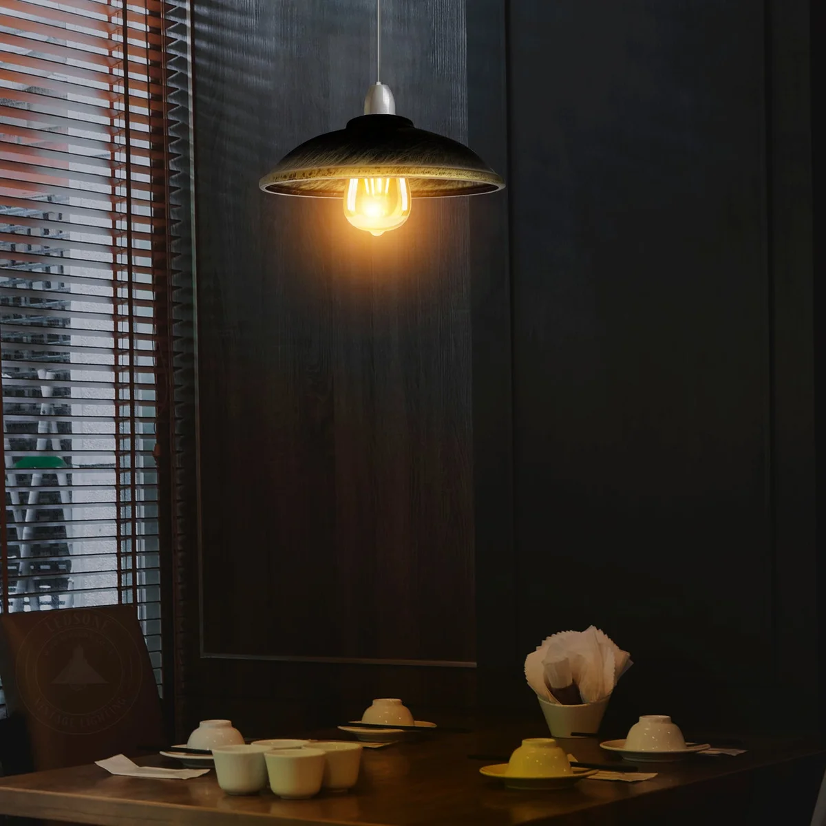 Green brass light shade with half-round metal design and concrete effect finish, shown from side angle on white background