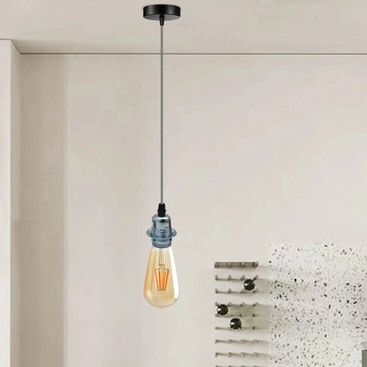 Modern chrome pendant light with polished finish and 2m adjustable cable, suitable for E27 bulbs and indoor use