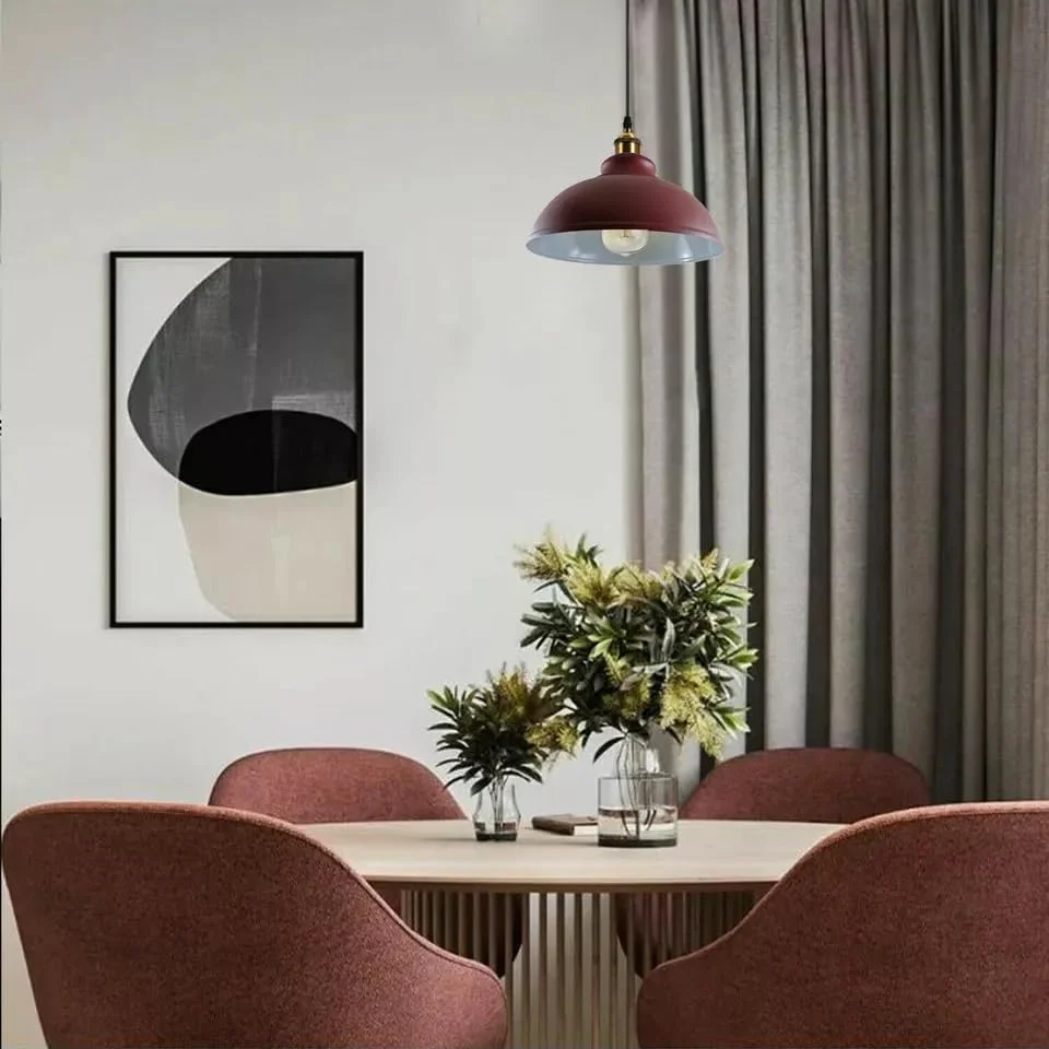 Curvy metal pendant light in vintage burgundy with E27 fitting, shown hanging against a neutral background