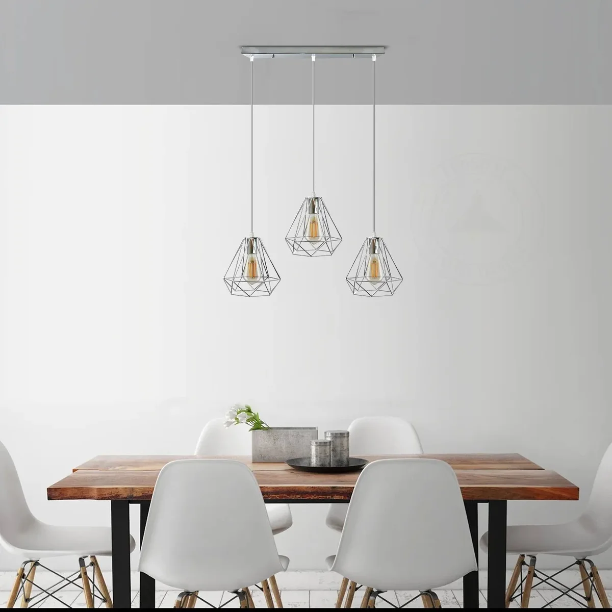 Three chrome metal diamond cage pendant lights with E27 base hanging light bulbs suspended from ceiling rose