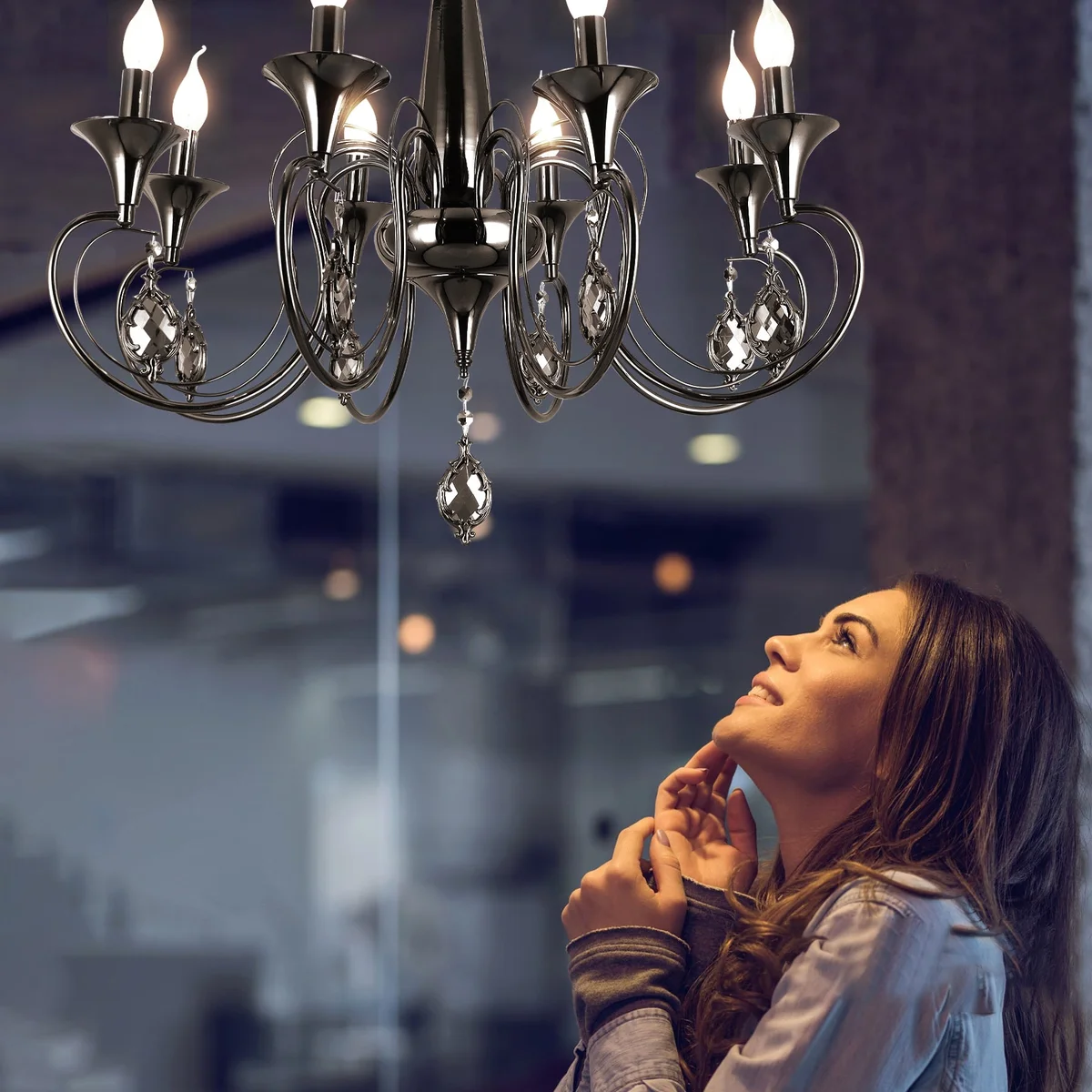 Black candle chandelier with 6 curved arms, crystal droplets, and adjustable chain, ceiling mounted with black metal finish