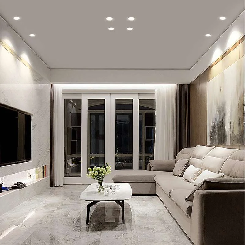 Modern round panel LED light recessed in ceiling showing cool and warm white illumination with adjustable beam angle
