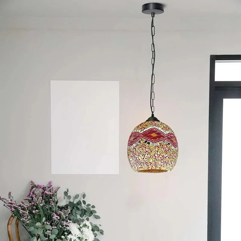 Vintage Moroccan style mosaic glass pendant light with colorful intricate dome-shaped stained glass shade hanging from chain