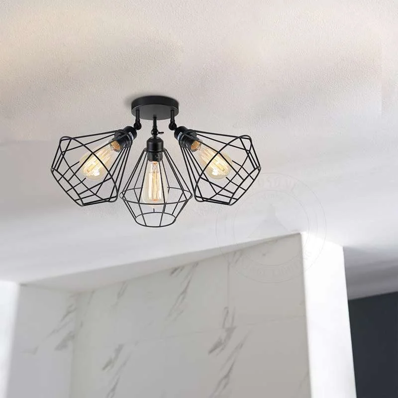 Black 3 head ceiling light with adjustable metal wire cage shades in contemporary vintage style flush mount design