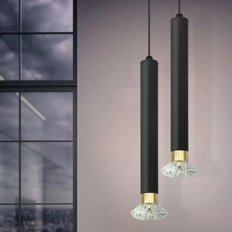 Modern black pendant light with geometric aluminium tube in diamond shape, hanging from adjustable cable with LED bulb included