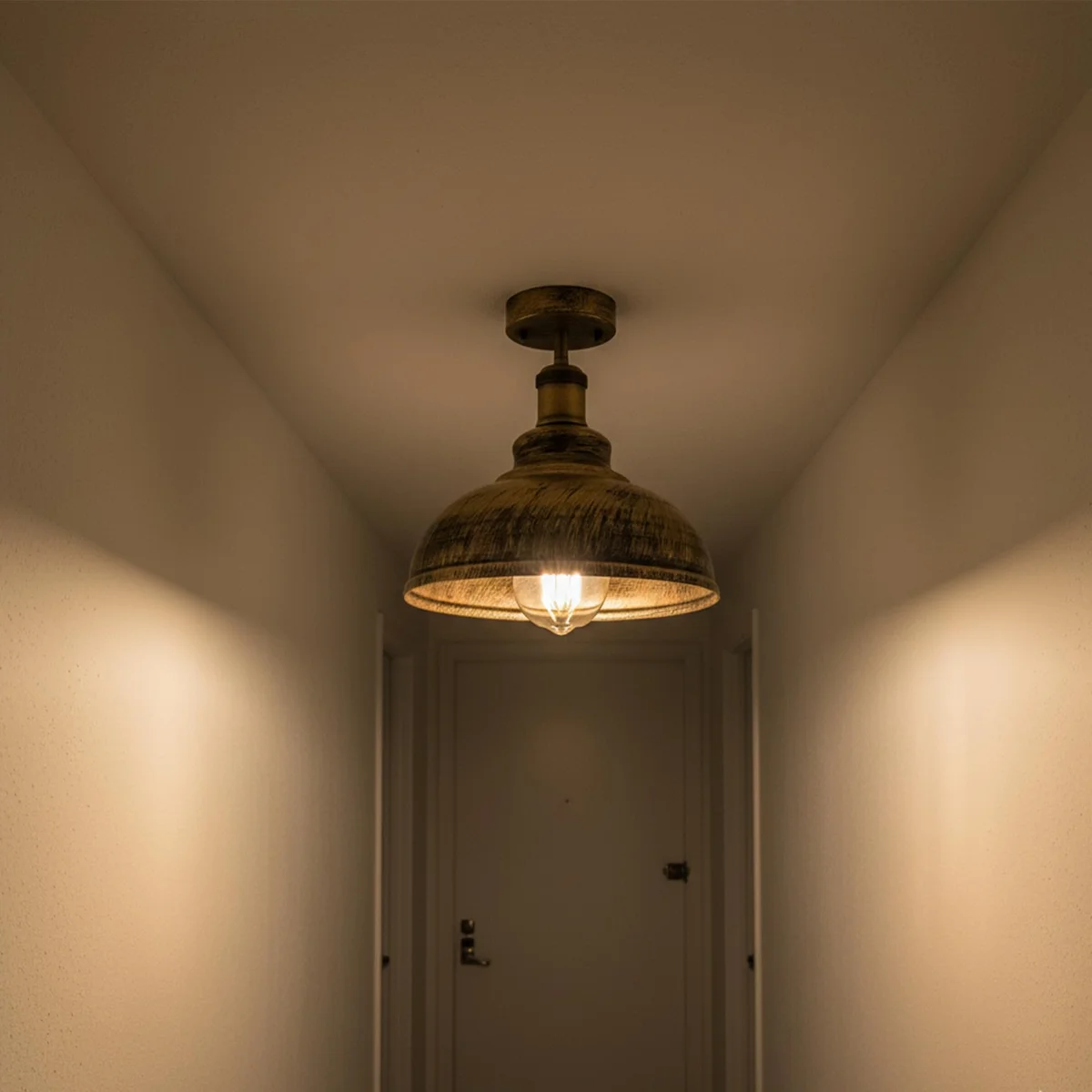 Retro copper dome shade pendant lamp with brushed metal finish and smooth curvy industrial design hanging from ceiling