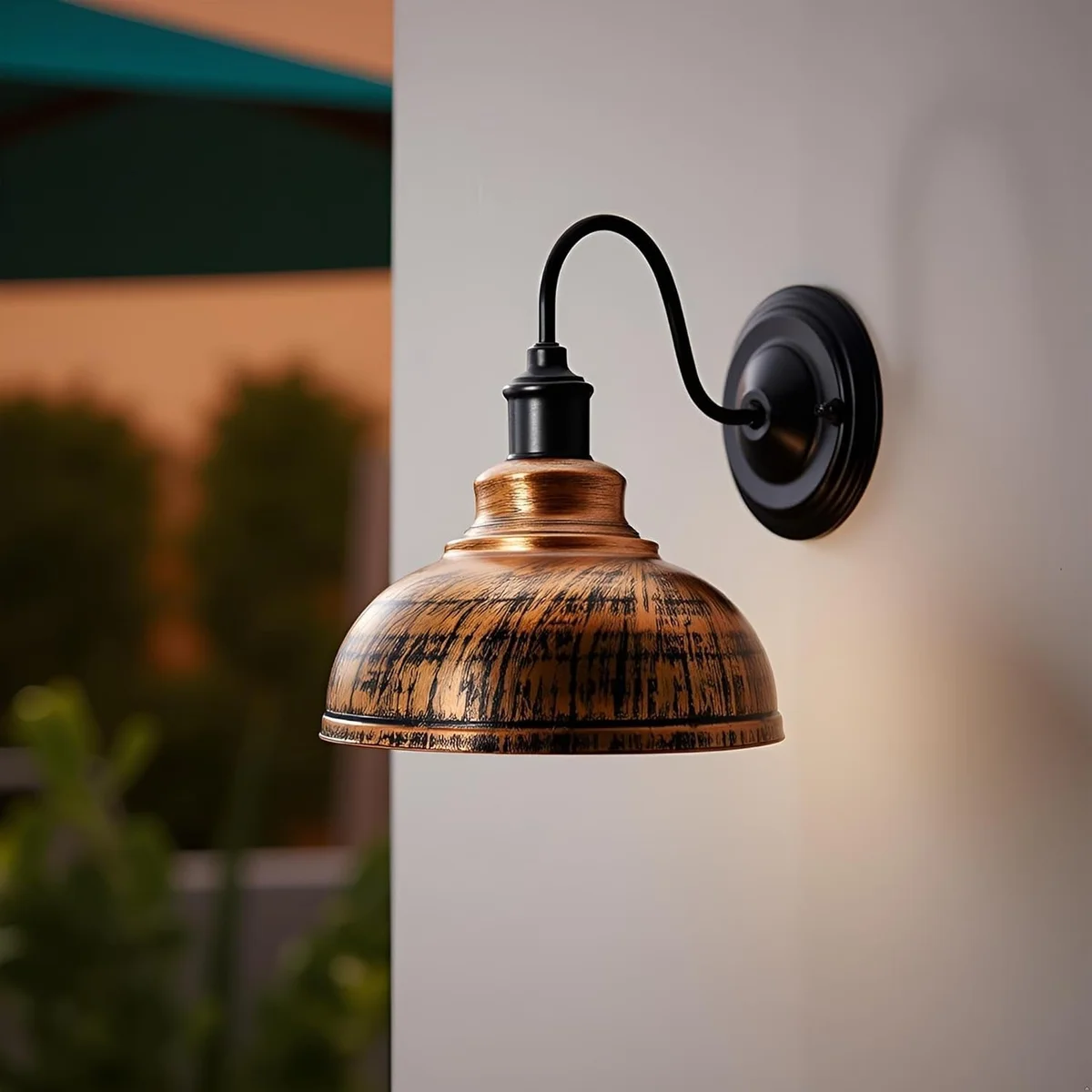 Brushed copper pendant lampshade with curvy dome shape shown hanging, highlighting its smooth metal finish and open bottom design