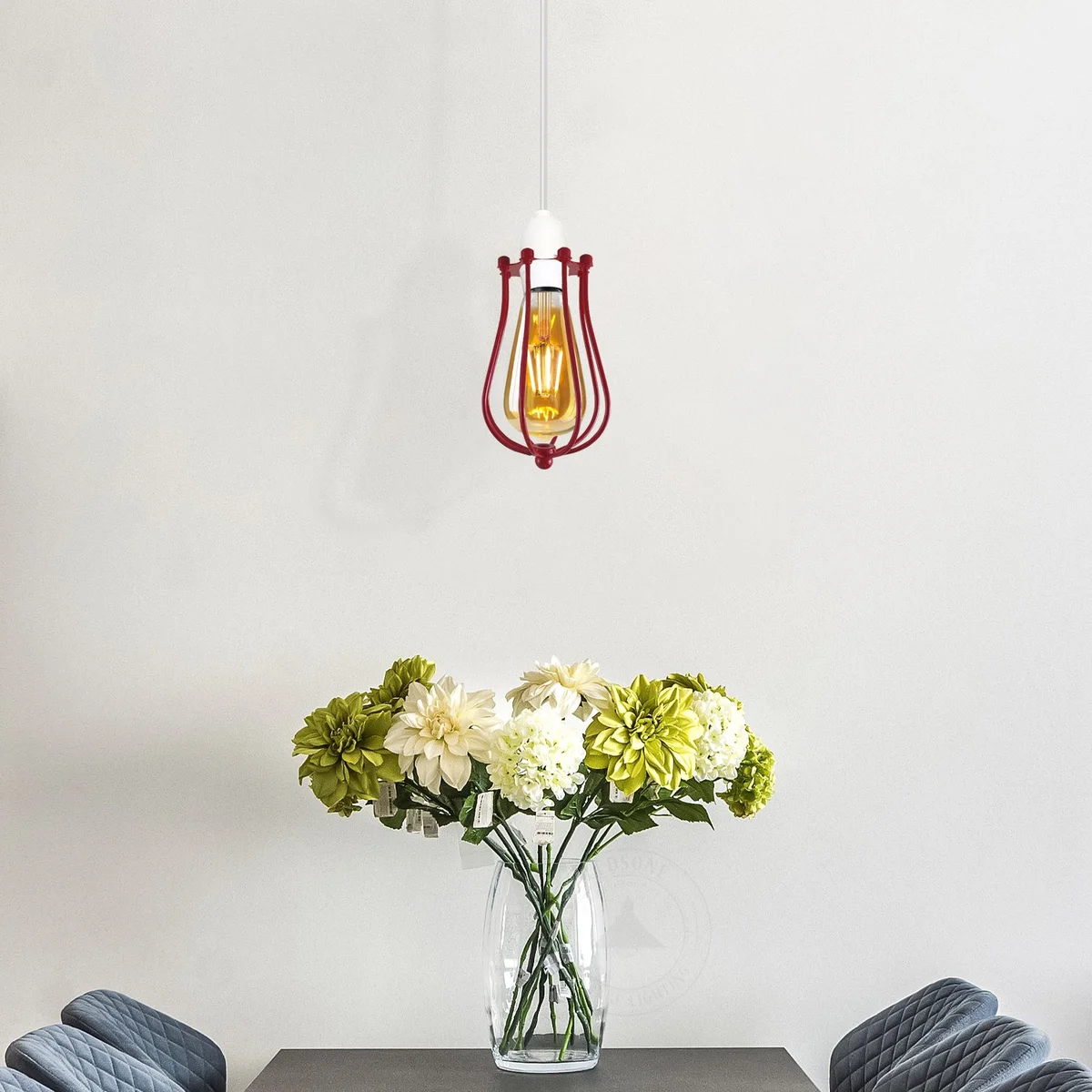 Vintage balloon-shaped metal wire cage shade in rustic finish hanging against a white background