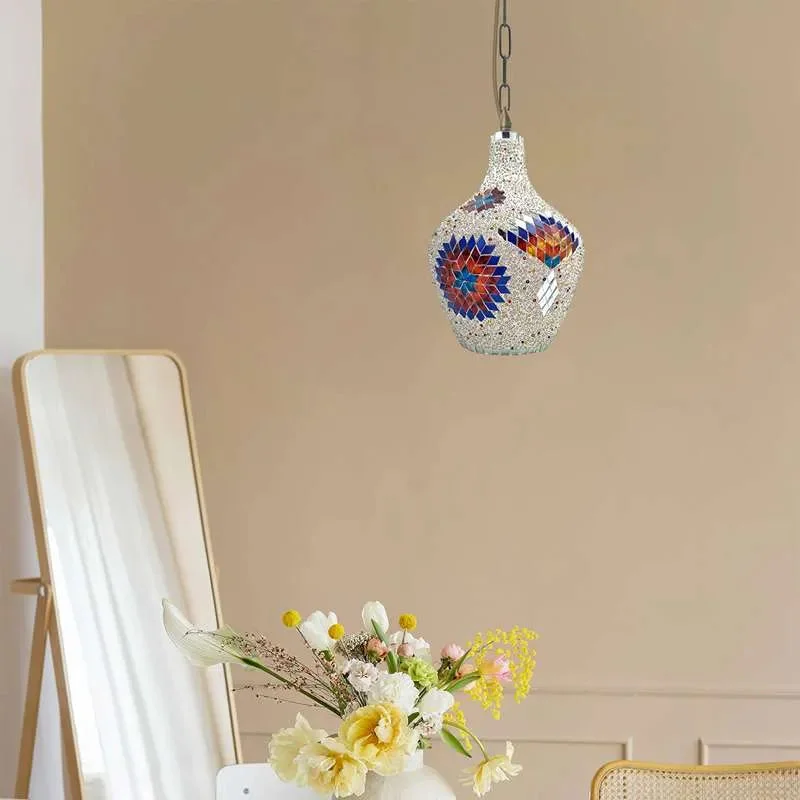 Antique brass Moroccan pendant ceiling light with colorful mosaic glass tiles and bell-shaped shade hanging on metal chain