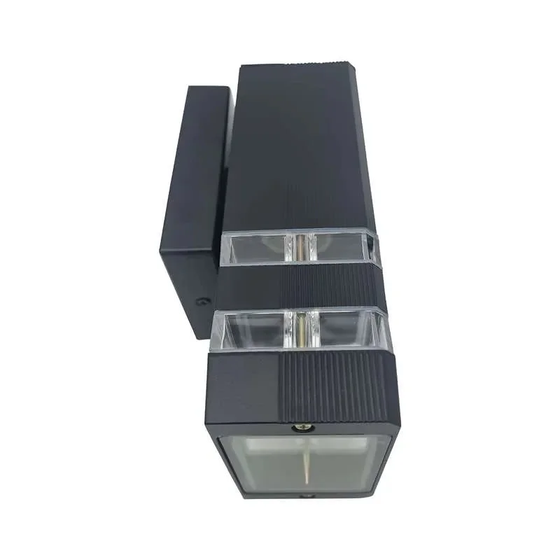 Modern black outdoor wall light mounted on a porch wall, emitting warm white LED light with a sleek square design