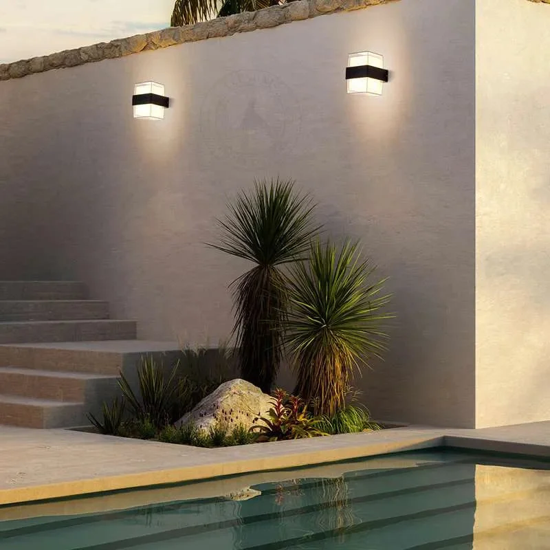Black and white modern cuboid outdoor wall sconce with up/down warm LED light, suitable for wet conditions IP54 rated