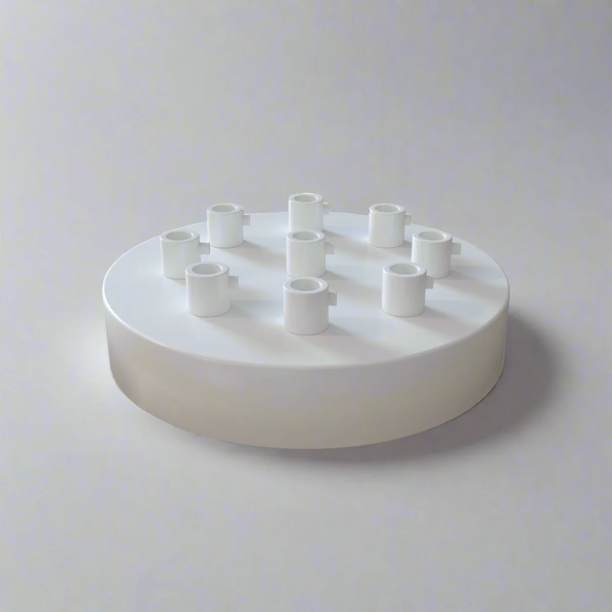 White metal ceiling rose with nine outlets, 120mm diameter, 25mm deep, featuring black cord grip and ceiling bracket