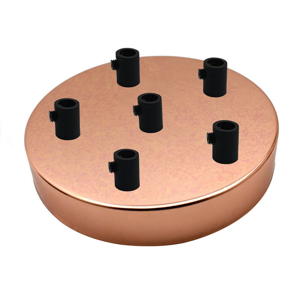 Rose gold ceiling rose with six outlets, round metal design, 120mm diameter, includes cord grips and mounting screws