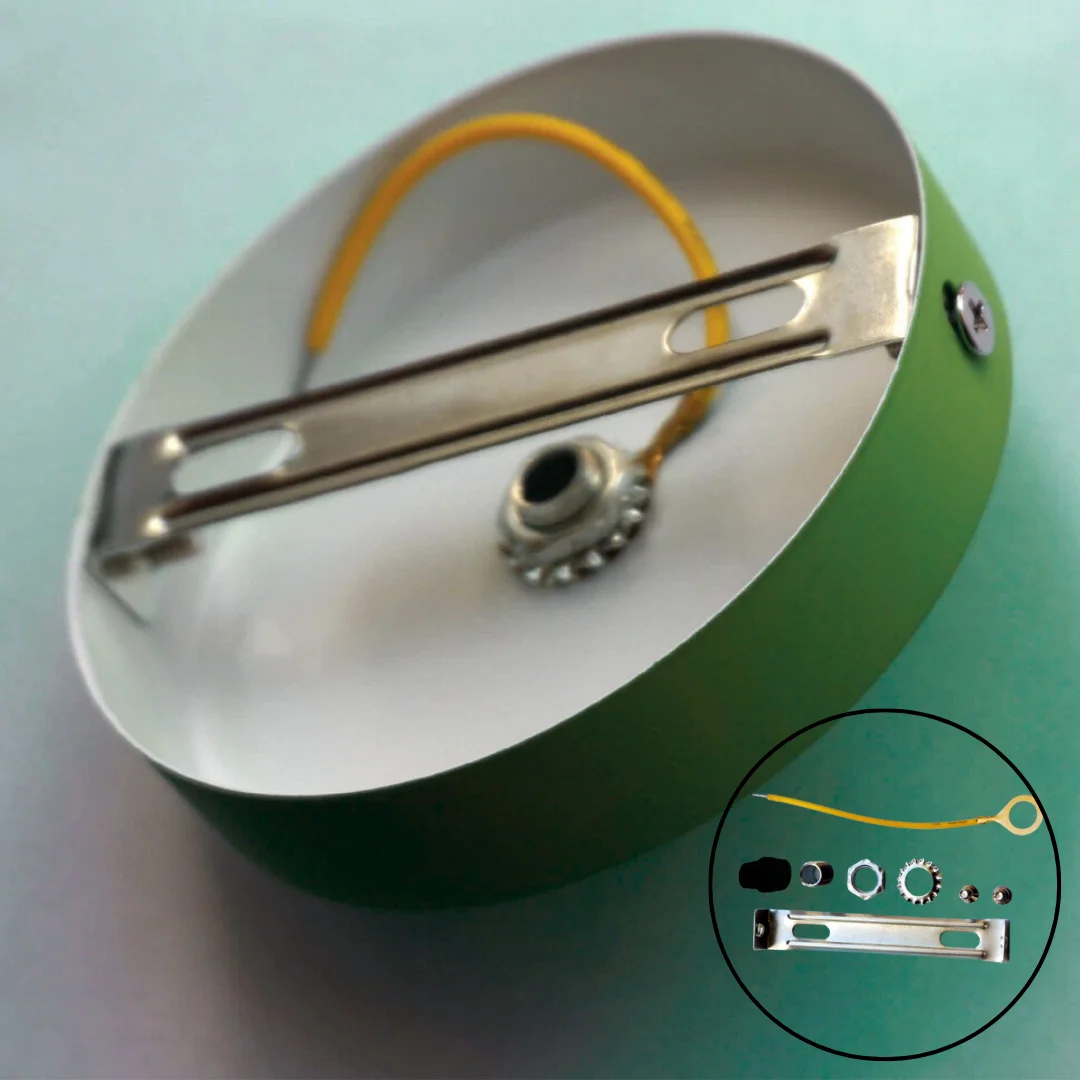 Five green round ceiling roses with cord grips and mounting screws arranged on a white background