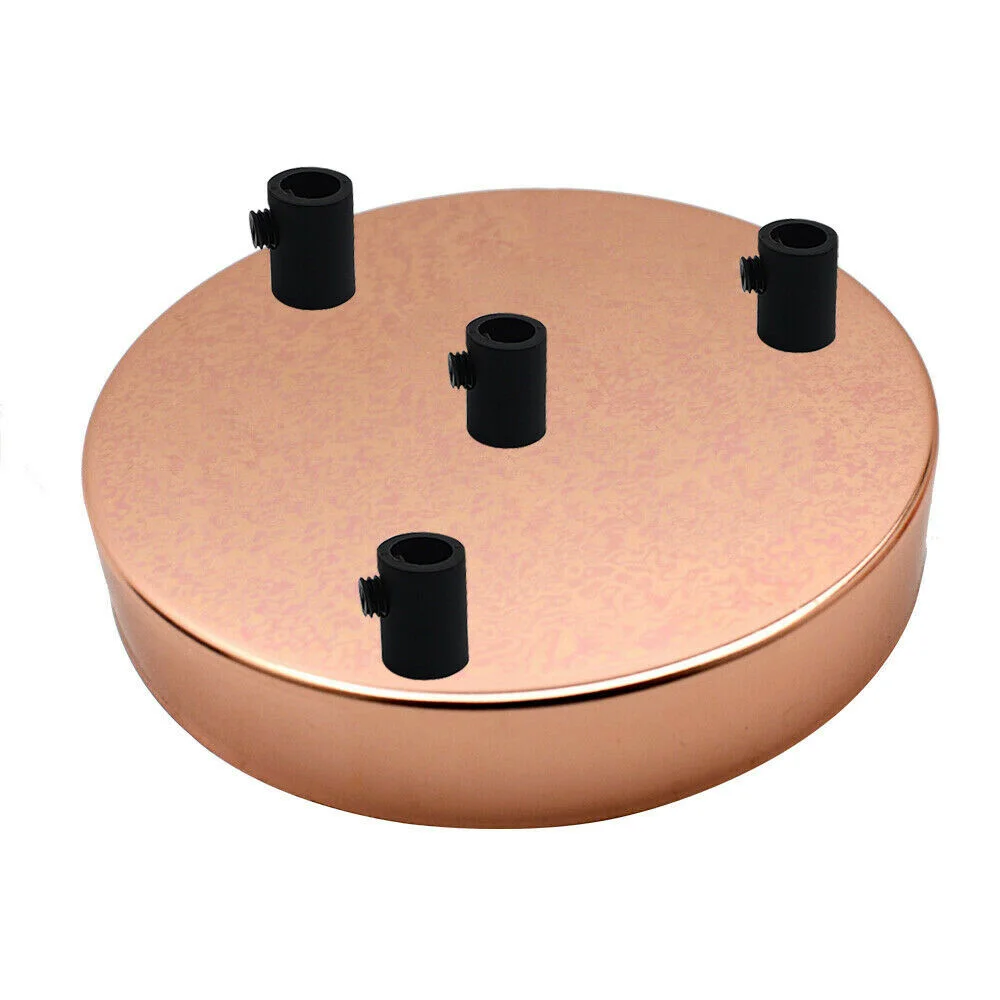 Round rose gold ceiling rose with 4 outlets, metal construction, 120mm diameter and black cord grip accessory visible