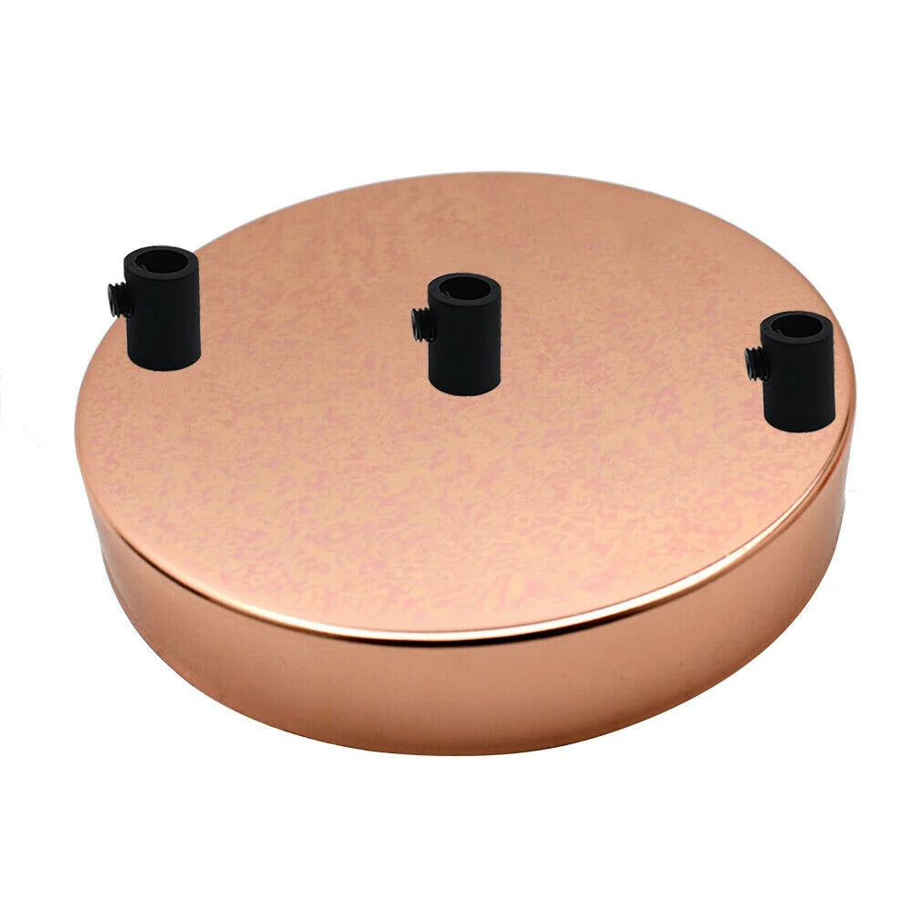 Round rose gold ceiling rose with 3 outlets, metal construction, and black cord grips, 120mm diameter, 25mm deep.