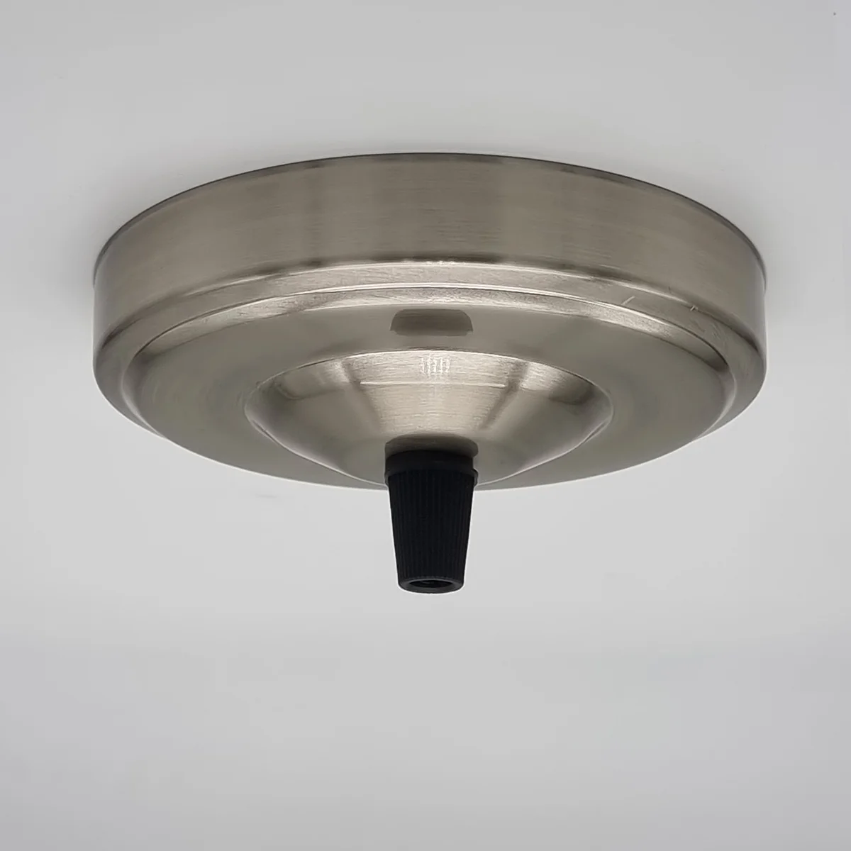 Single outlet ceiling rose pendant light fitting in satin nickel metal with mounting hardware on white background