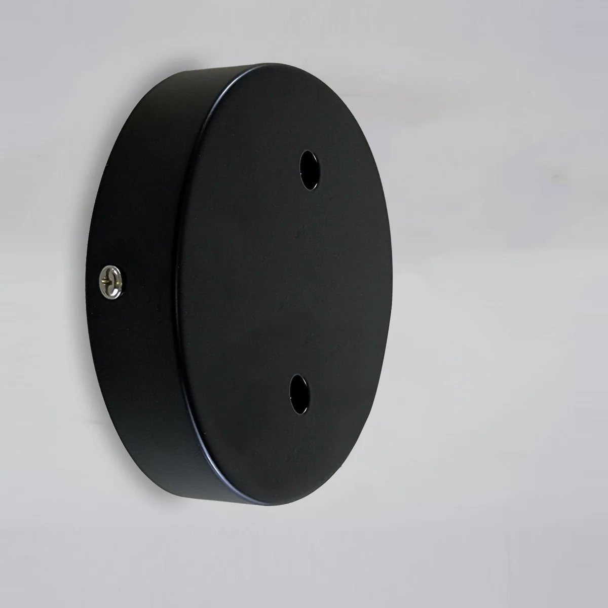 Black multi-point ceiling rose with round matte metal finish and cord grips for pendant and wall lights installation