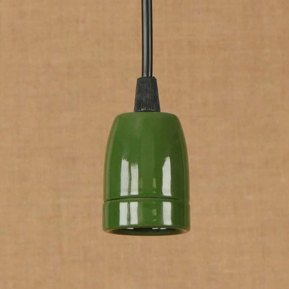 Green vintage E27 bulb holder shown from side, retro porcelain lamp fitting with industrial style and ceramic finish