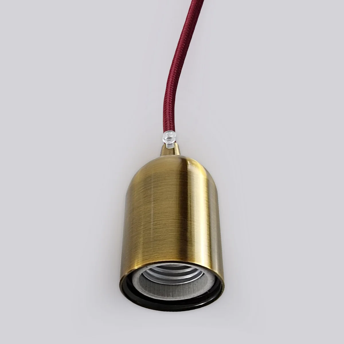 Smooth yellow brass E27 lamp holder with vintage metal finish, showing screw base and durable construction details