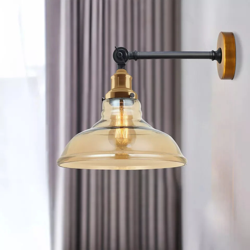 Sleek amber glass wall light with metal fittings, projecting warm amber glow in modern industrial style