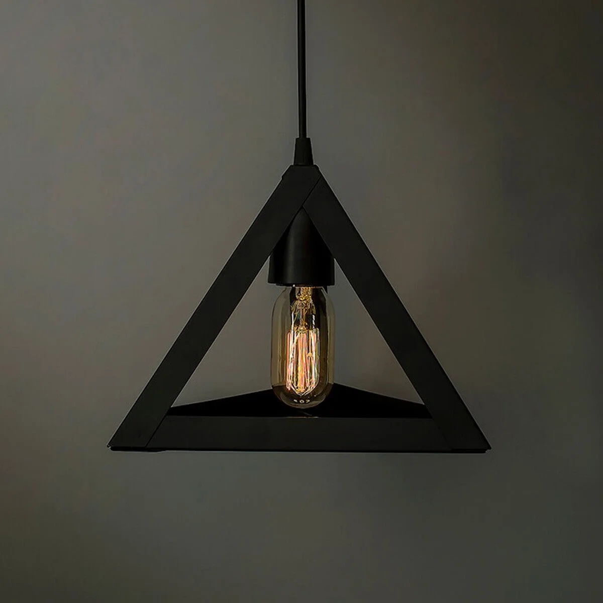 Triangular black metal pendant lampshade, wire cage design, retro industrial style, mounted on ceiling.