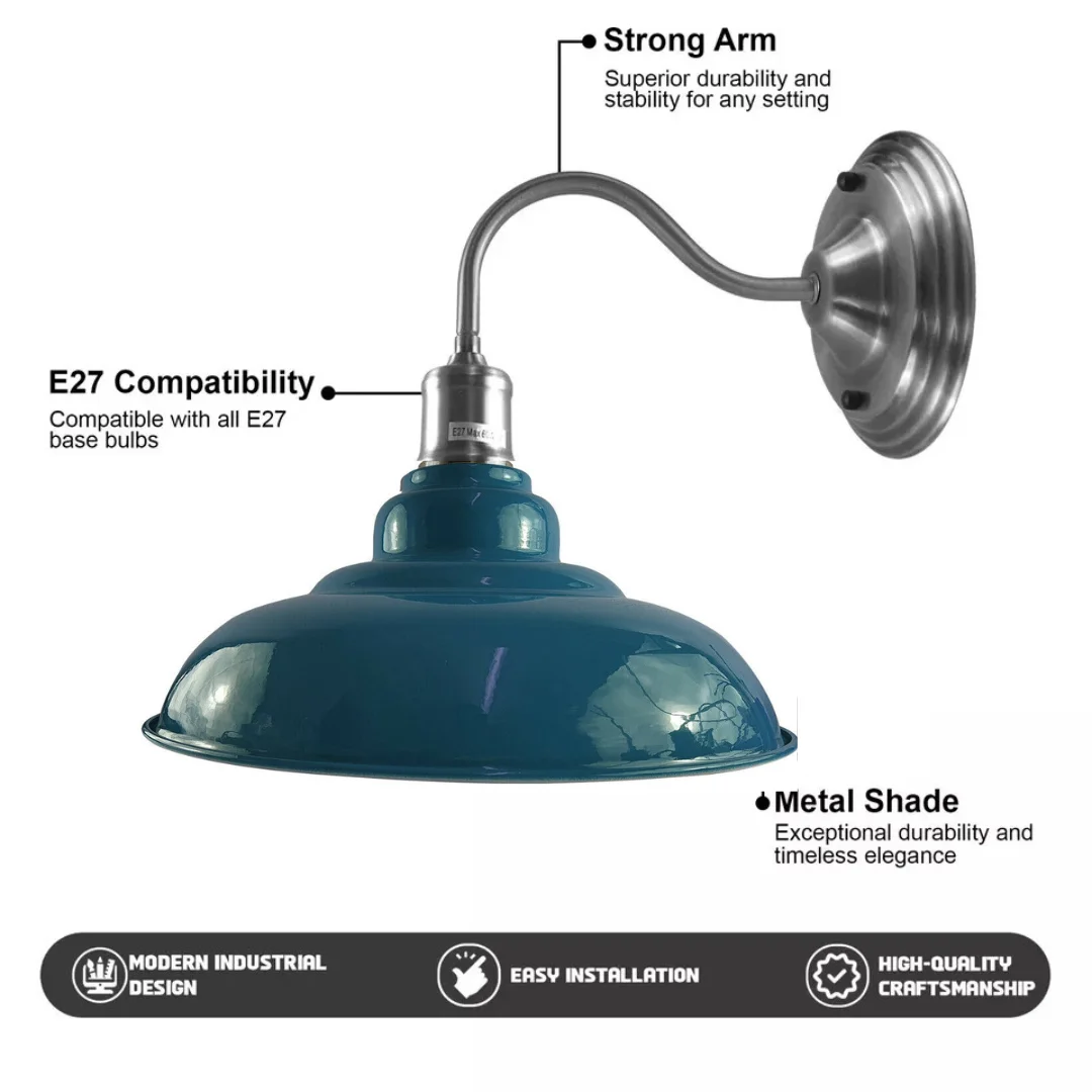Blue metal wall light fitting with sleek bowl shade, white interior hood, curved metal arm – modern industrial design