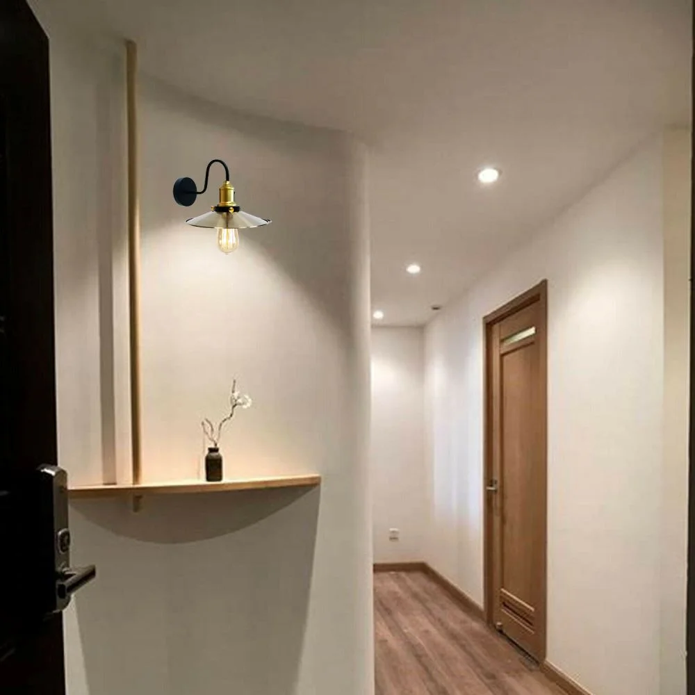 Green brass cone industrial wall lamp with matte finish and white interior, mounted on a ceiling plate.