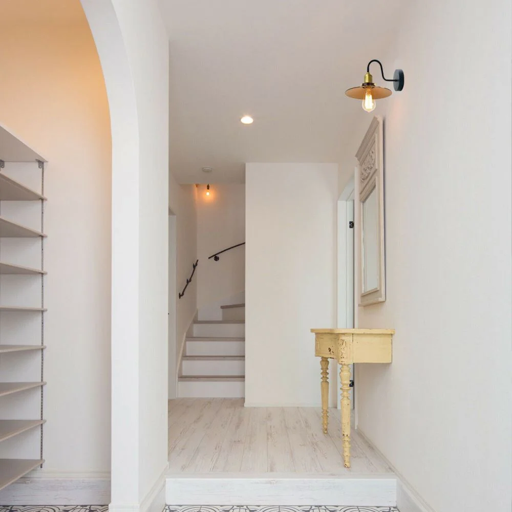 Yellow brass vintage industrial lamp with swan‑neck arm, adjustable metal shade, black holder, hanging wall mounted.