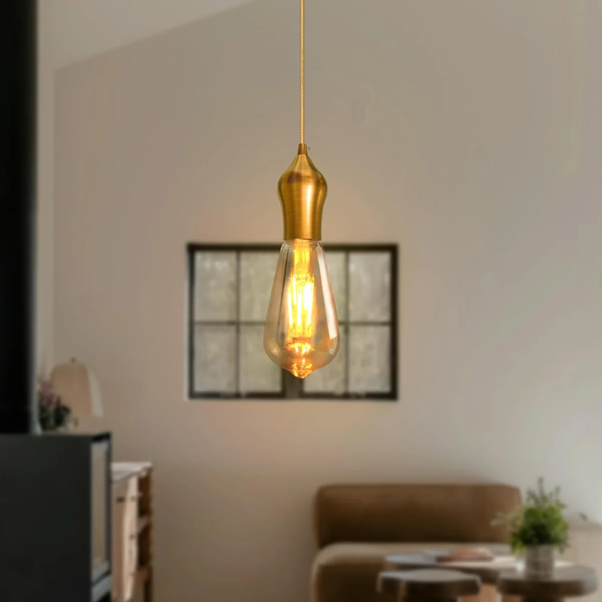 Retro bulb holder in yellow brass metal, showing the exposed E27 socket fitted to a small round frame