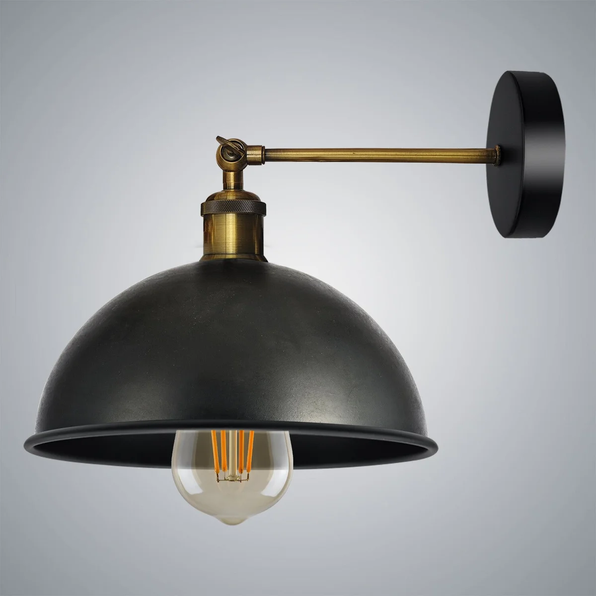 Black metal cage wall light with dome shade, swing arm, E27 holder on a wall.
