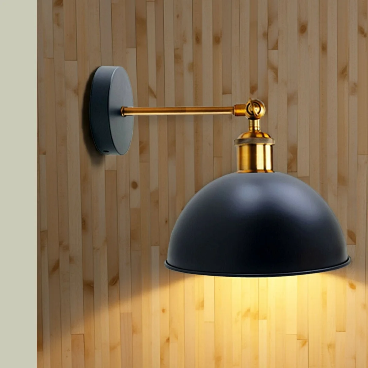 Black metal cage wall light with dome shade for indoor outdoor use, swing arm and E27 socket