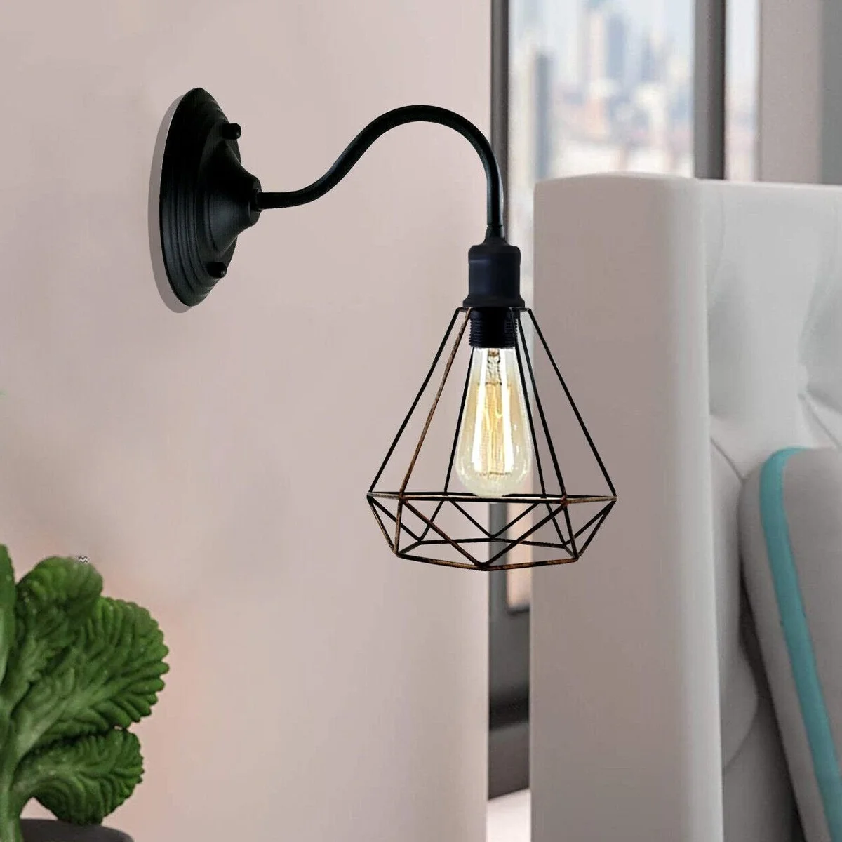 A black metal wall lamp featuring a diamond-shaped 20 cm shade on a metal arm.