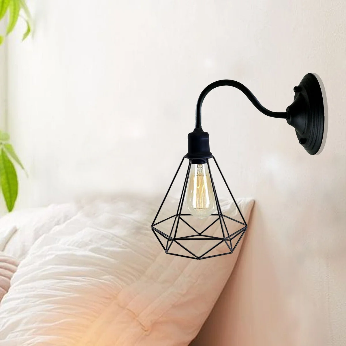 Black metal diamond shade wall light with metal arm and lamp holder, vintage industrial style.