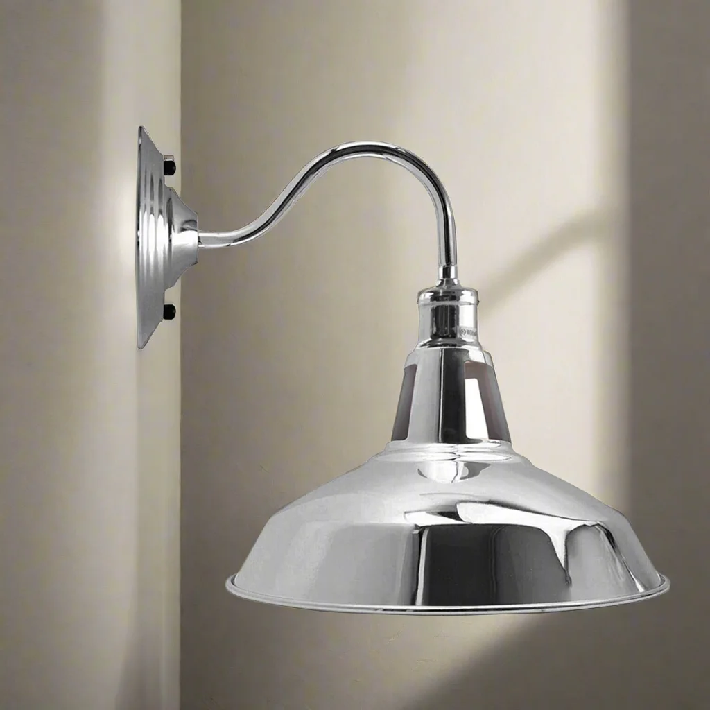 Industrial wall light with metal barn‑style shade in black, showing glossy finish and mounting hardware.