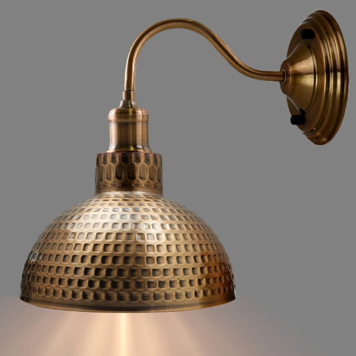 Yellow brass hammered metal indoor wall light with E27 holder, light arm, and ceiling rose in a sleek industrial style.