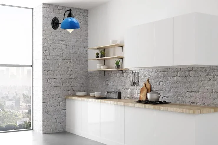 Blue wall sconce with metal dome shade, 21 cm diameter, mounted on interior wall, elegant industrial lighting.