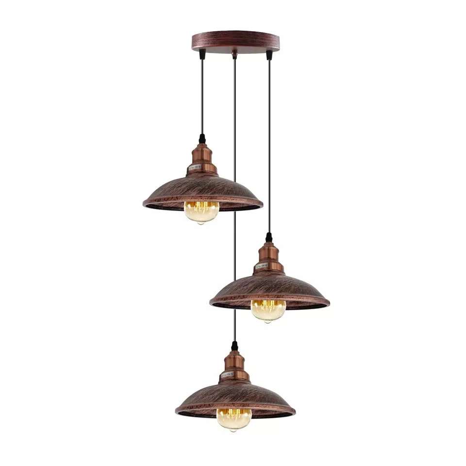 Retro pendant light hanging from ceiling, metal shade and black cord, classic style.
