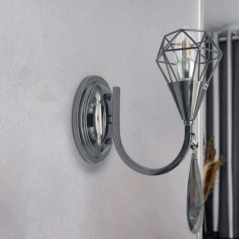 Modern wall lighting: chrome curved arm fixture with K9 crystal droplet and single candelabra bulb