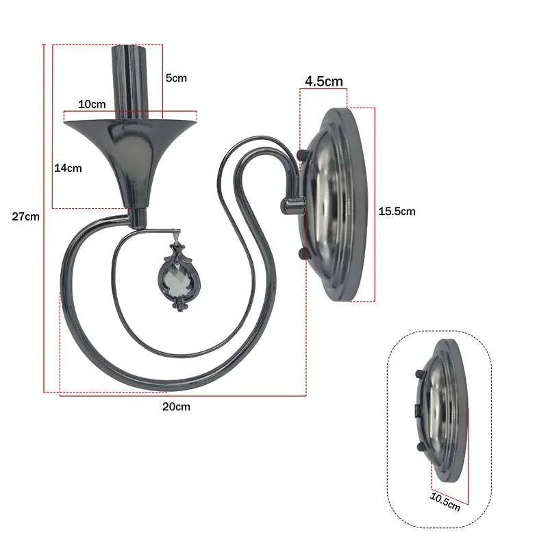 Polished chrome curved arm wall light with a single candelabra glow, mounted on a circular back plate for a vintage look.