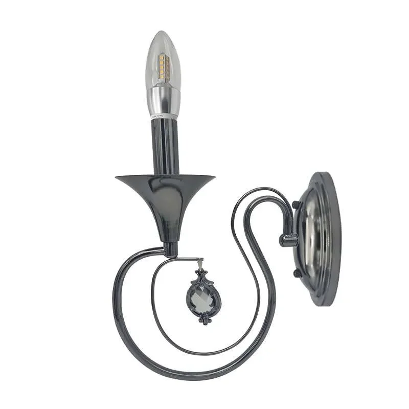 Polished chrome vintage style wall light with curved arm and single candelabra shade, mounted on a circular back plate.