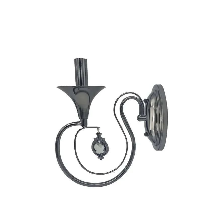 Polished chrome metal candle wall light with circular back plate and curved arm, single candelabra light, dimmable.